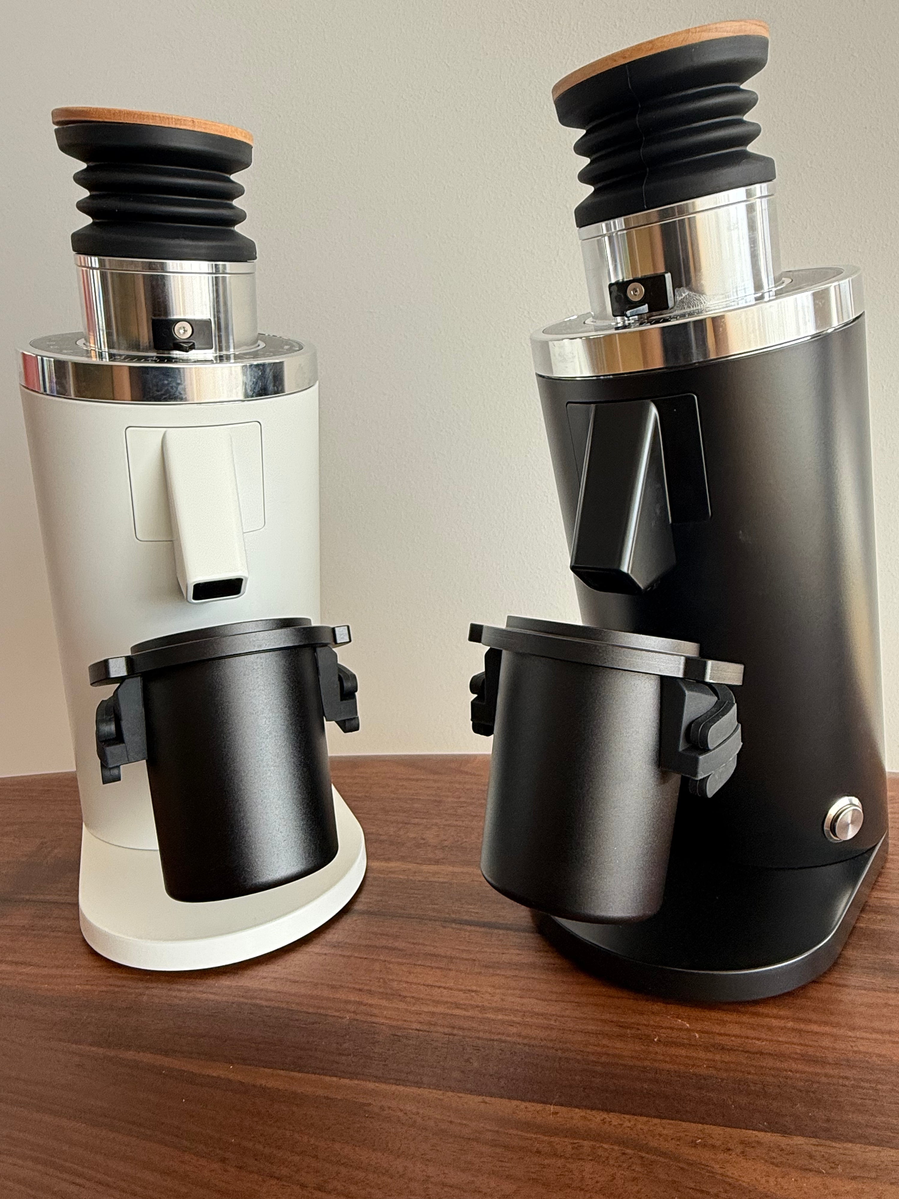 DF54 single-dose coffee grinders in black and white with black metal dosing cups - Grind Logic