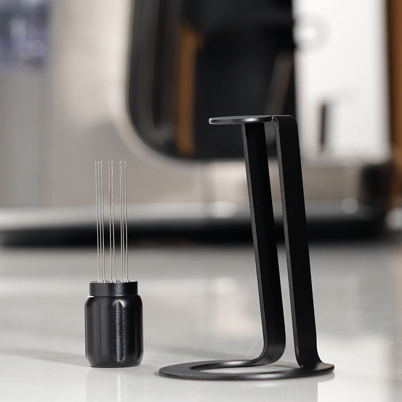 Black Grind Logic Magnetic WDT Tool beside its aluminium stand