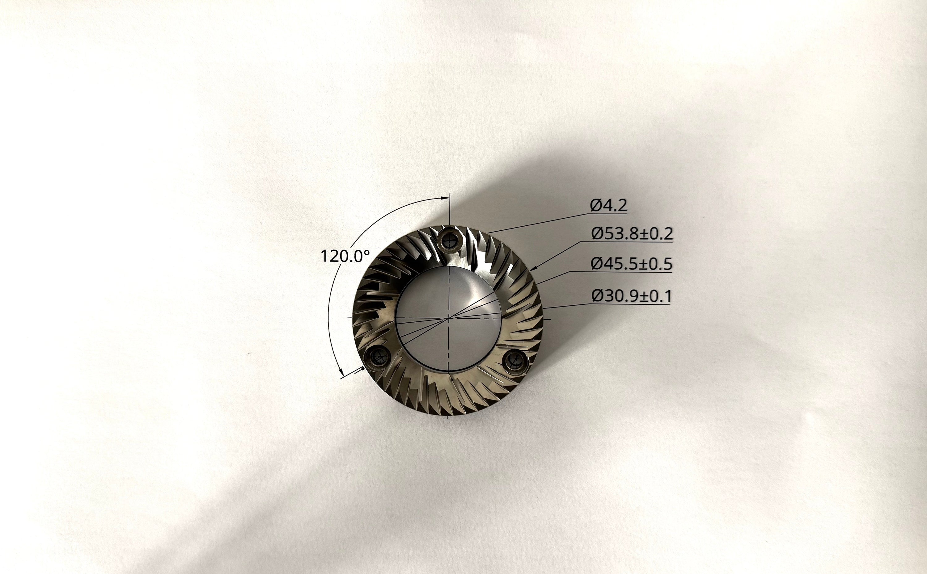 54mm flat coffee grinder burr placed over a technical drawing showing burr geometry and dimensions - Grind Logic