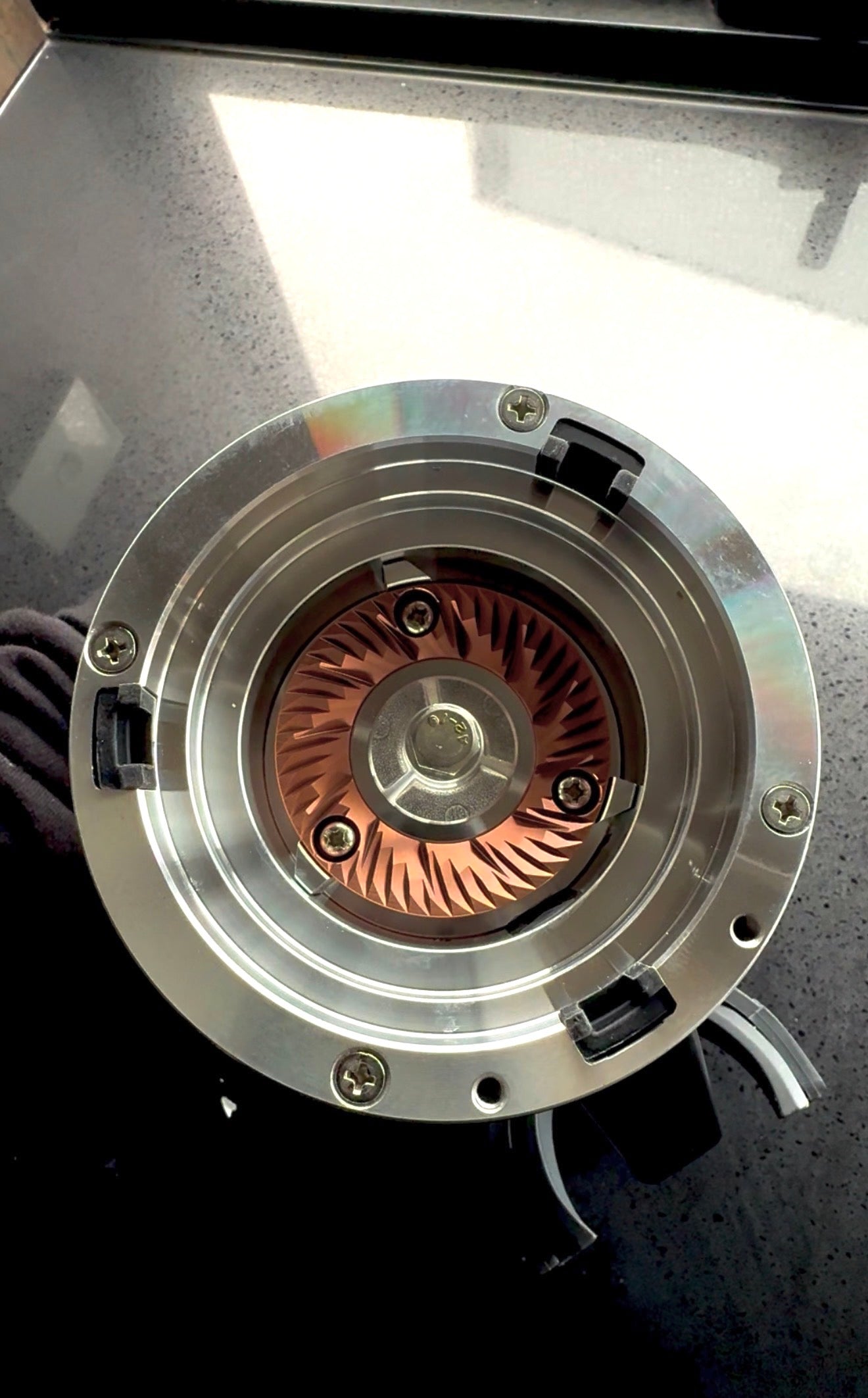 54 mm Red Titanium burr installed inside a DF54 coffee grinder with the upper burr carrier removed - Grind Logic