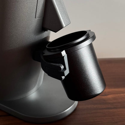 Metal dosing cup on a grey DF54 Coffee Grinder - Grind Logic